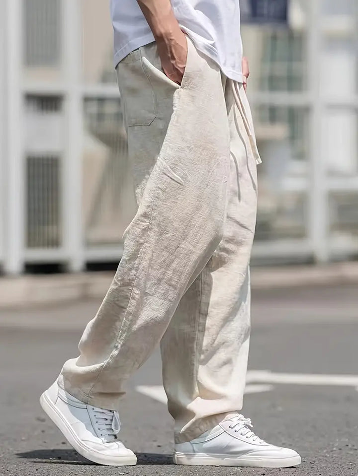 Stylish men's relaxed fit wide leg trousers for summer comfort, ideal for everyday and travel wear.