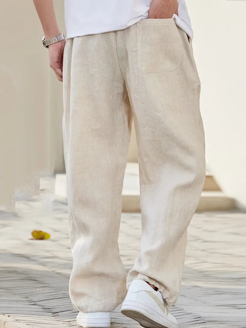 Comfortable men's relaxed fit trousers, offering an effortless, minimalist look for spring & summer fashion.