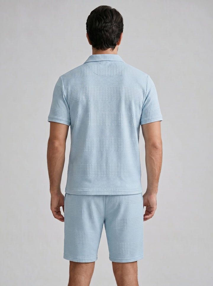 Men's casual summer outfit: Textured knit polo shirt with matching shorts.