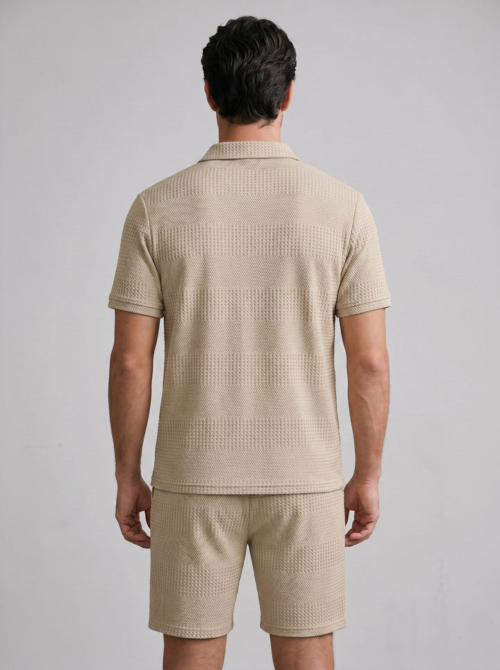 Textured men's knit polo shirt and shorts, a versatile casual summer outfit.