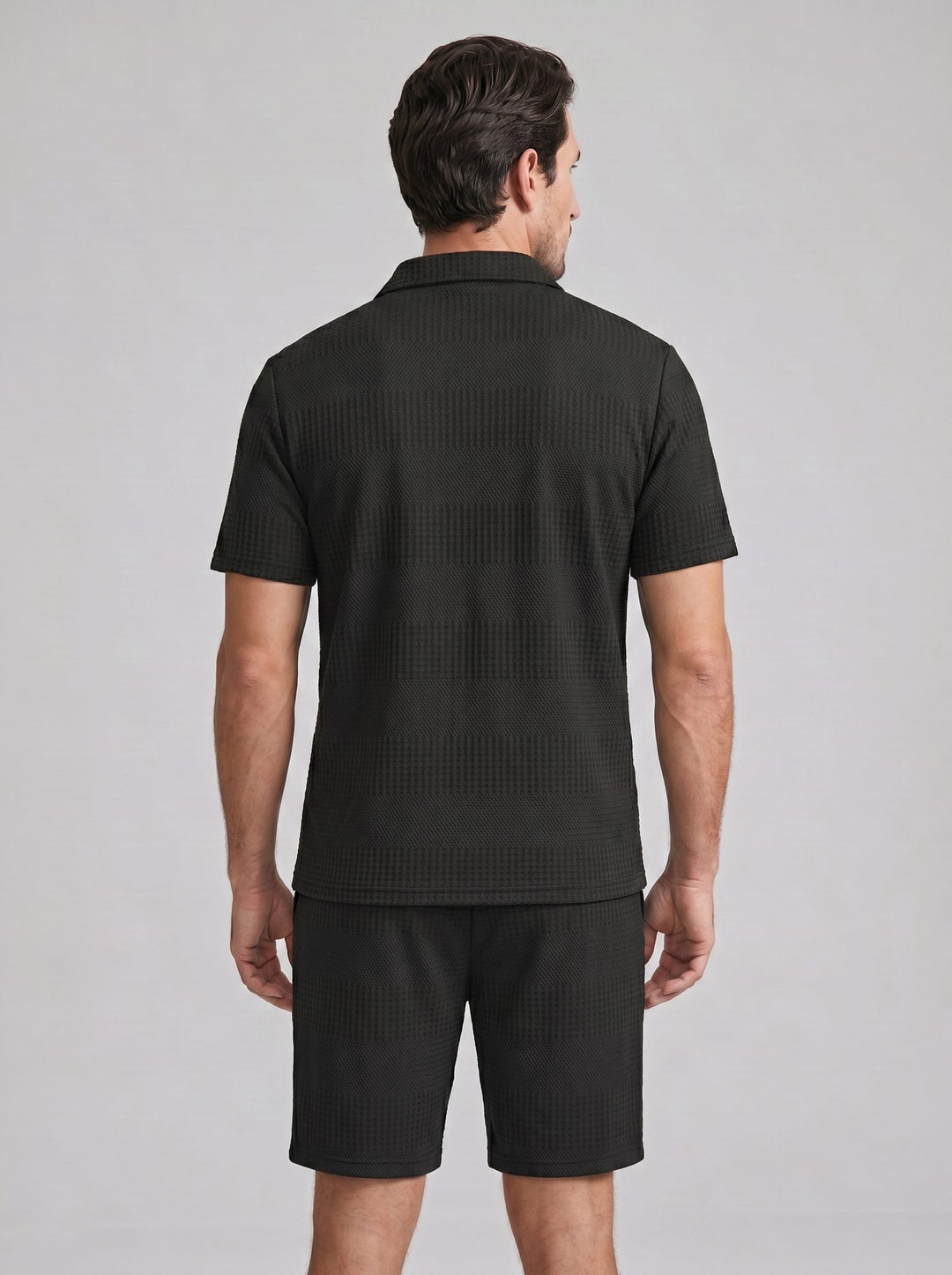 Comfortable men's textured knit polo shirt and shorts for a relaxed summer look.