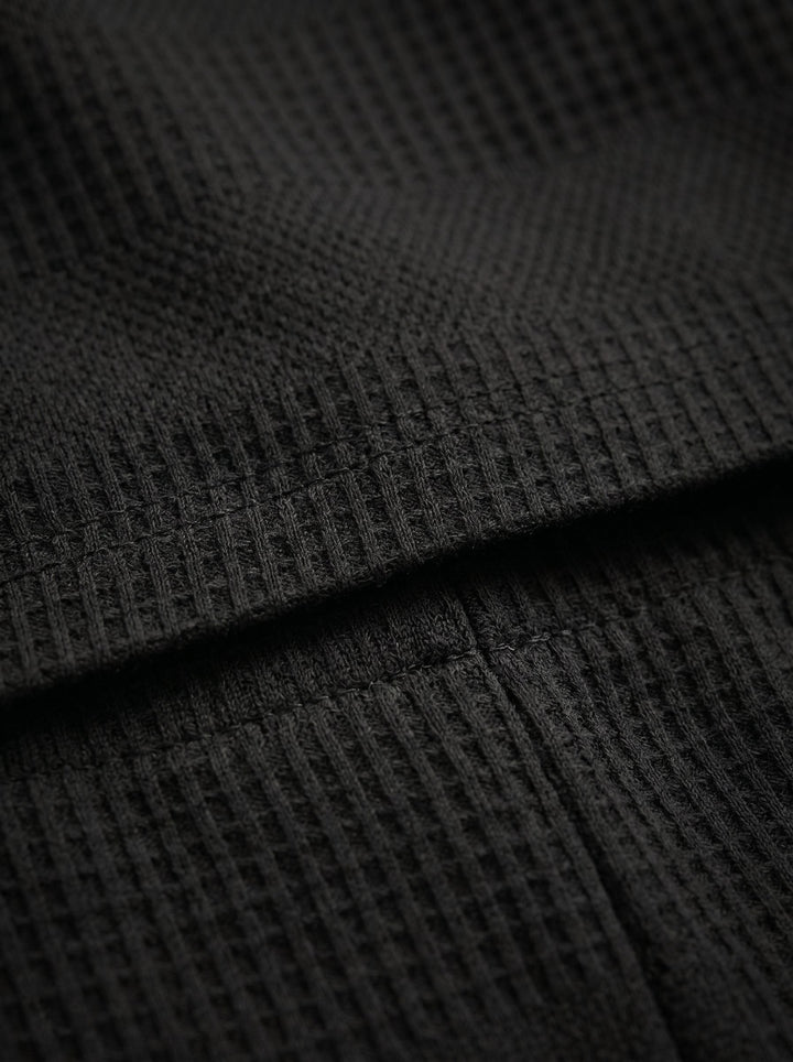 Men's casual summer knitwear: Relaxed fit polo shirt and coordinating shorts.