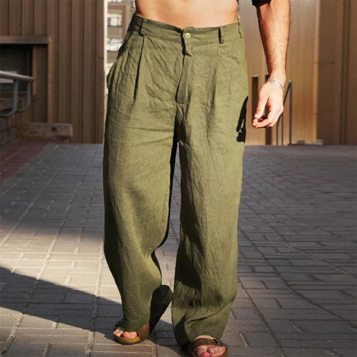 Pleated men's linen trousers, wide leg & breathable fabric for relaxed summer days.