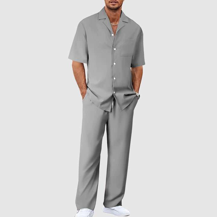 Stylish men's matching resort set with revere collar shirt and comfortable relaxed trousers for holidays.