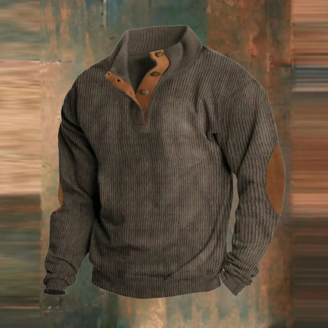 Close-up of men's vintage-style ribbed pullover sweater featuring a quarter-snap collar and classic elbow patches.