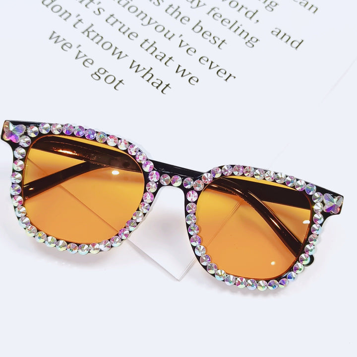 Fashion men's rhinestone cat-eye sunglasses with UV protection. Glamorous party and beach shades.