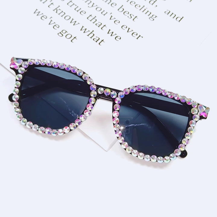 Dazzling men's rhinestone cat-eye sunglasses. UV protective stylish shades for a trendy look.