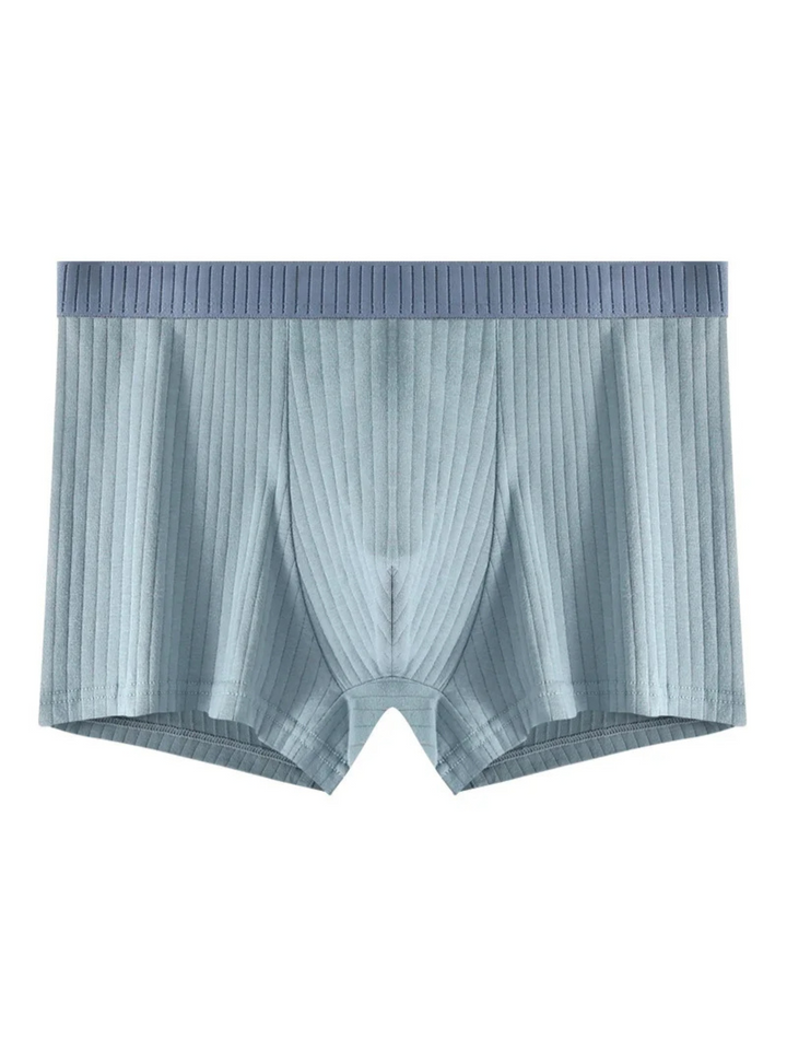 Detailed view of the ribbed texture on men's boxer briefs, emphasizing the soft feel and secure everyday fit.