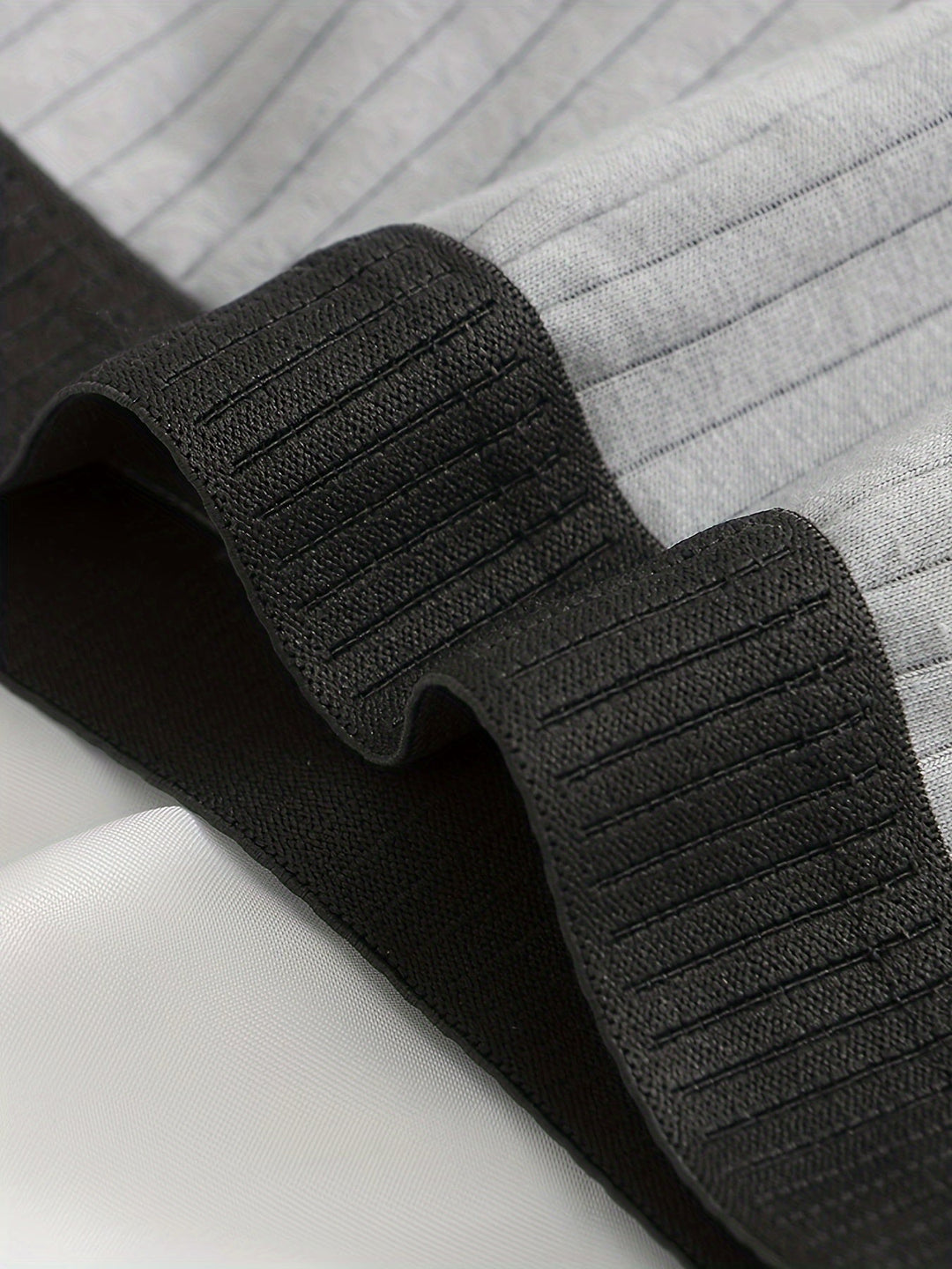 Versatile men's boxers: a multi-pack of ribbed, moisture-wicking boxer briefs for active and everyday wear.