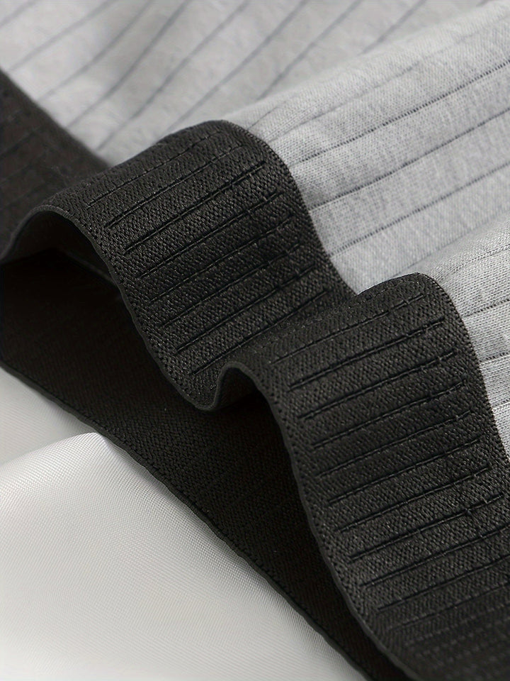 Versatile men's boxers: a multi-pack of ribbed, moisture-wicking boxer briefs for active and everyday wear.