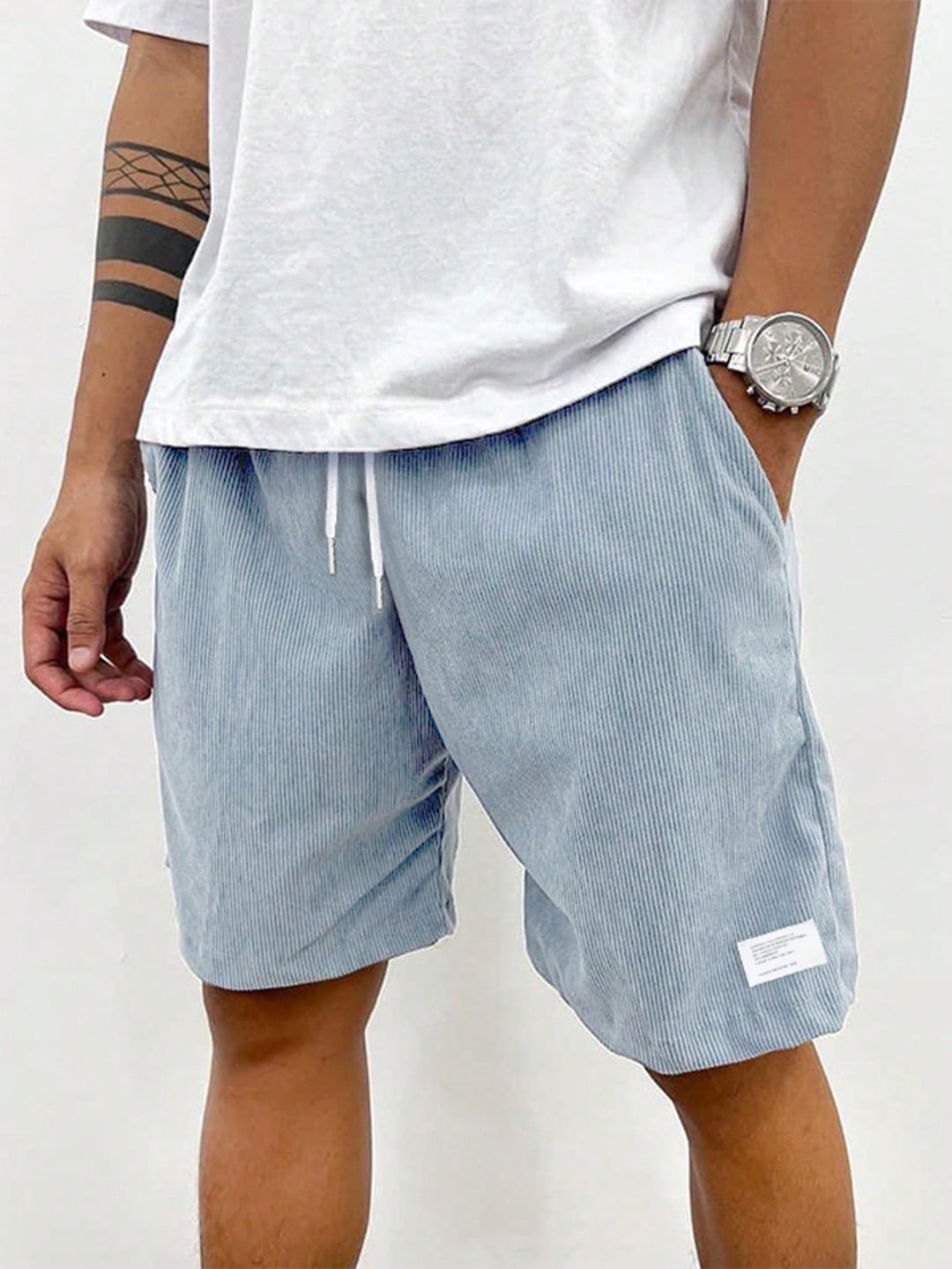 Summer essential: Men's mid-thigh ribbed drawstring shorts. Casual, breathable, comfortable for warm weather.
