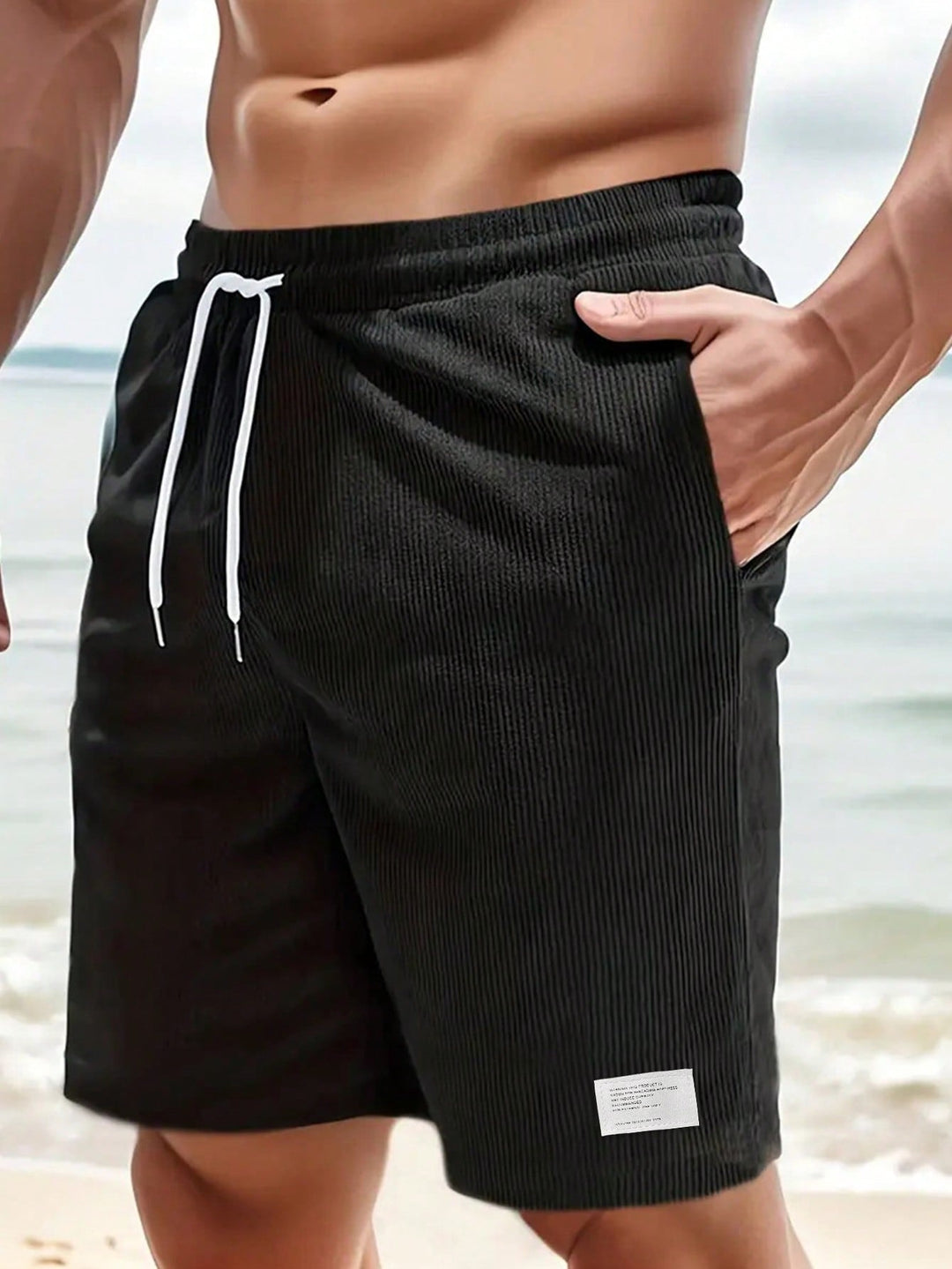 Close-up of ribbed texture on men's casual drawstring shorts. Showcases soft fabric for comfortable everyday wear.