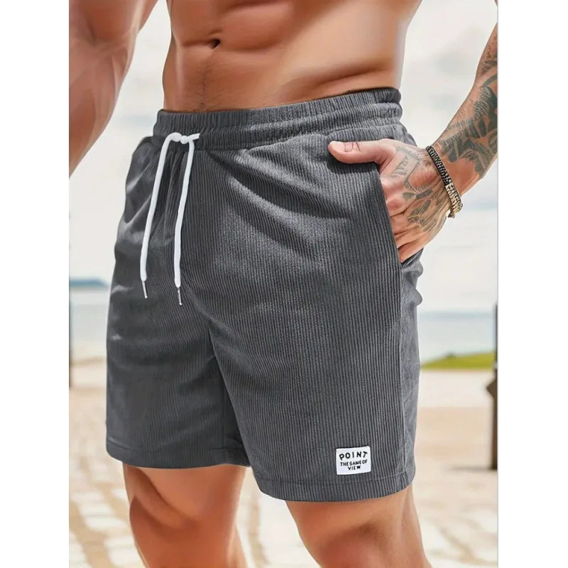 Ribbed men's swim shorts with adjustable drawstring. Quick-dry, comfortable beachwear.