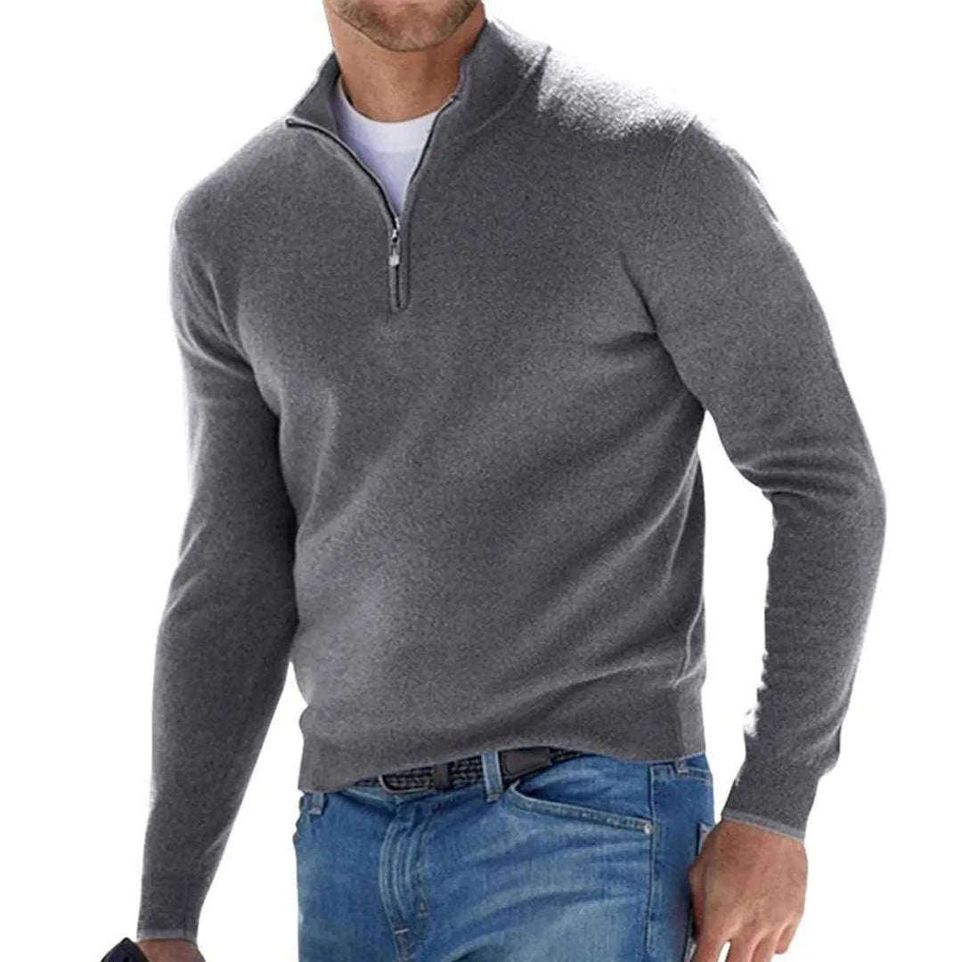 Stylish men's ribbed quarter-zip pullover knit sweater. Features a half-zip neckline for smart casual layering.