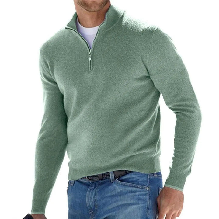 Men's fashion shot: model wearing a versatile ribbed quarter-zip pullover jumper, a smart casual winter essential.
