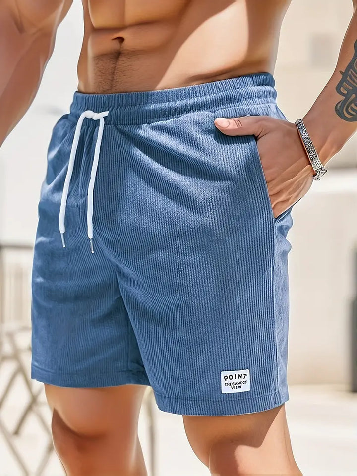 Blue men's ribbed quick-dry swim shorts, elastic waist, comfortable for pool & beach.