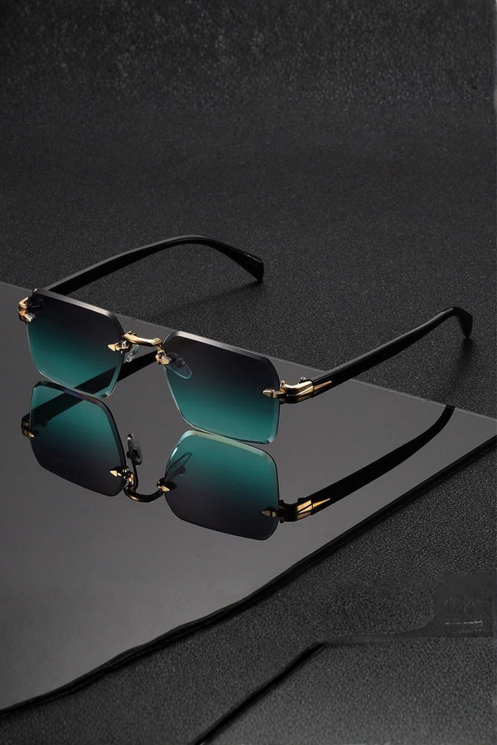 Rimless men's sunglasses, highlighting the sleek gold bridge & sophisticated gradient tinted lenses. Tinted eyewear.