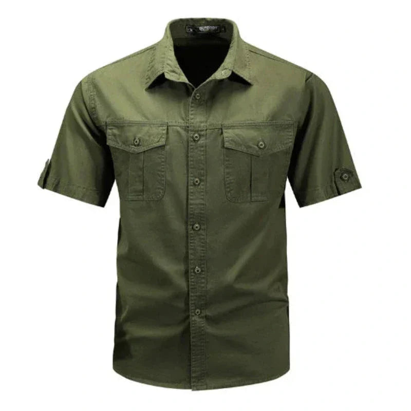 Close-up of a men's short sleeve cargo shirt showing functional chest pockets & durable fabric for outdoor comfort.