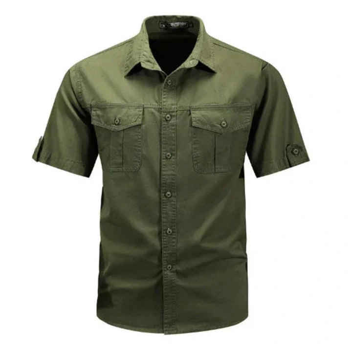 Close-up of a men's short sleeve cargo shirt showing functional chest pockets & durable fabric for outdoor comfort.