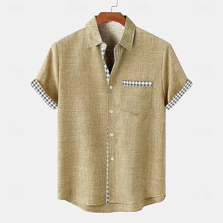 Relaxed fit men's casual short sleeve button-up shirt with unique contrast trim; versatile stylish top.