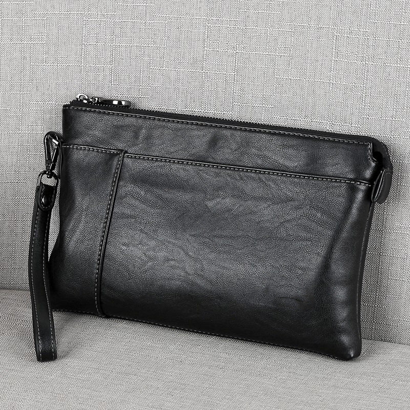 Stylish men's leather wristlet clutch, black, ideal everyday carry bag & travel accessory with sleek design.