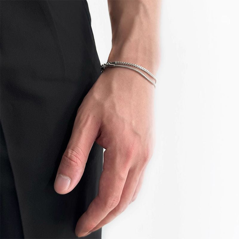 Elegant men's stainless steel double-chain bracelet, modern jewelry gift for men. Sleek silver-tone, sophisticated style.
