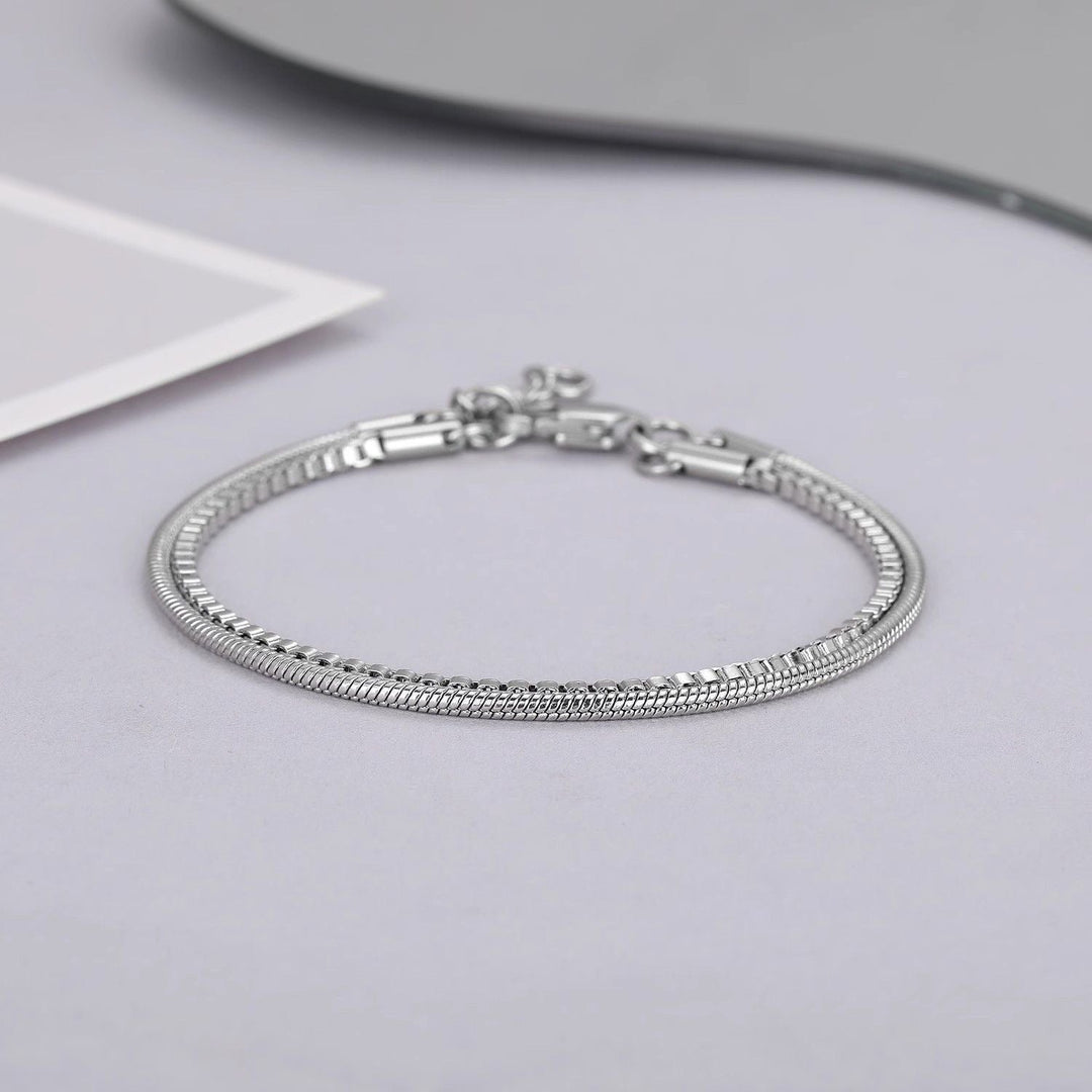 Modern men's double-chain stainless steel bracelet, sleek silver-tone design, ideal for everyday wear or as a gift.