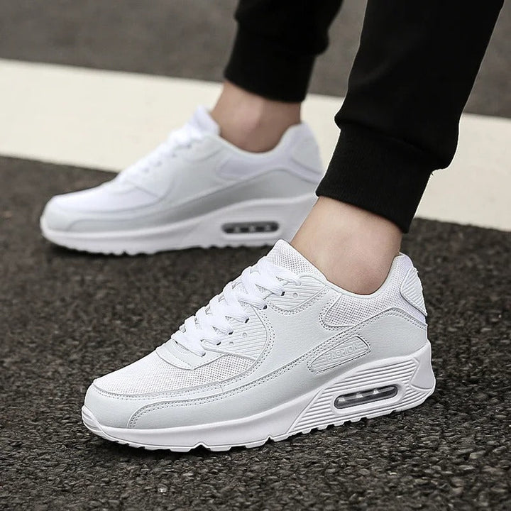 Comfortable men's high-sole white sneakers. Sleek urban style trainers for casual wear & modern streetwear fashion.