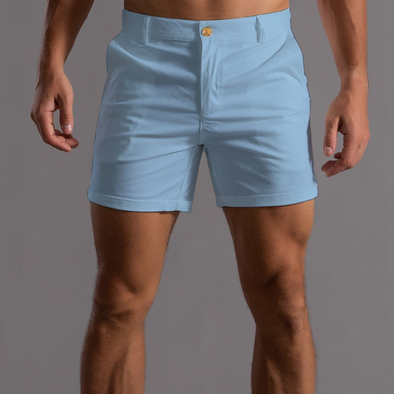 Pink men's sleek tailored chino shorts. Stylish and comfortable for a modern summer casual or elegant look.
