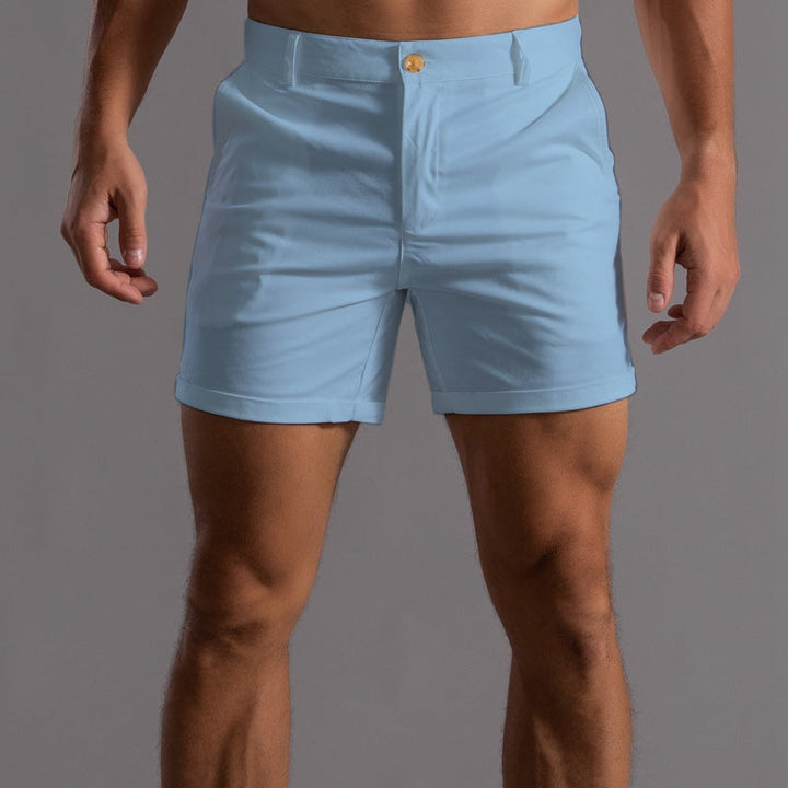 Pink men's sleek tailored chino shorts. Stylish and comfortable for a modern summer casual or elegant look.