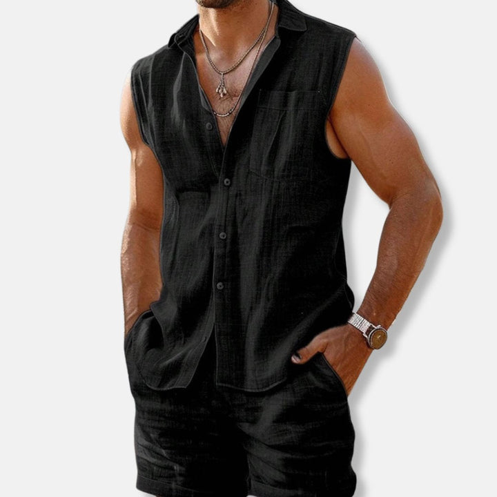 Stylish men's casual summer outfit: sleeveless button-down shirt and shorts for beach or resort.