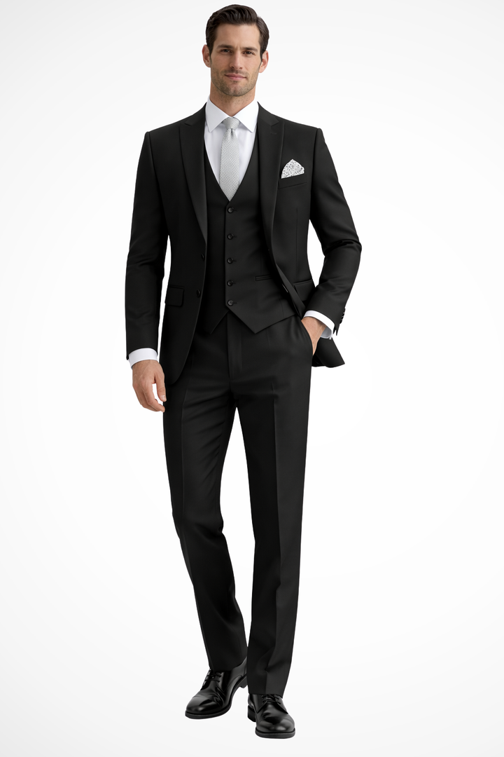 Man wearing a sharp slim fit 3-piece peak lapel suit, ready for a wedding or gala.