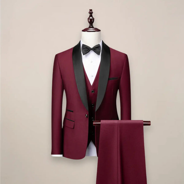 Black slim fit 3-piece tuxedo suit for men, featuring jacket, vest, and trousers, perfect for weddings & galas.