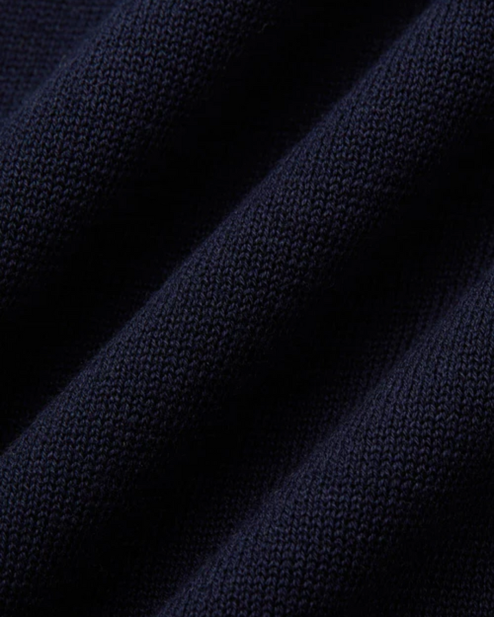 Fitted black men's polo shirt, short sleeve, offering a smart casual look for everyday style.