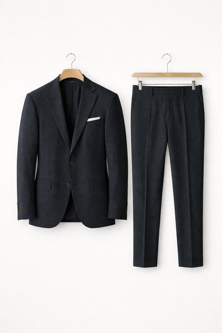 Crisp men's light grey slim-fit tailored suit. Professional two-piece for office fashion, weddings, or formal wear.
