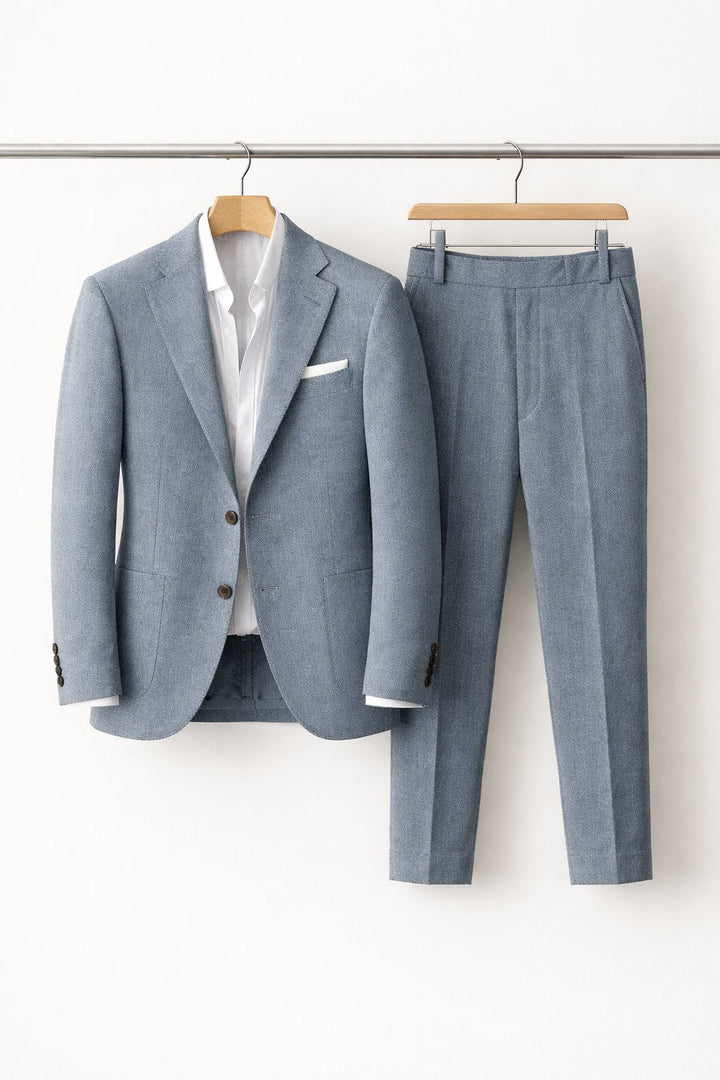Tailored men's slim-fit light grey suit. Versatile professional attire for weddings, business, and special occasions.