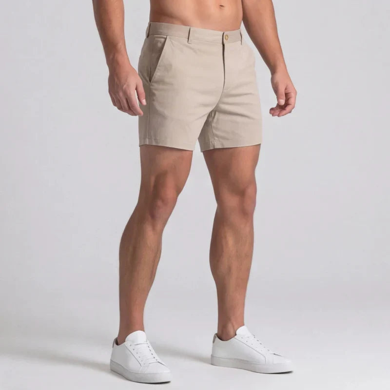 Detailed shot of men's tailored chino shorts with a slim fit, versatile for various summer occasions.