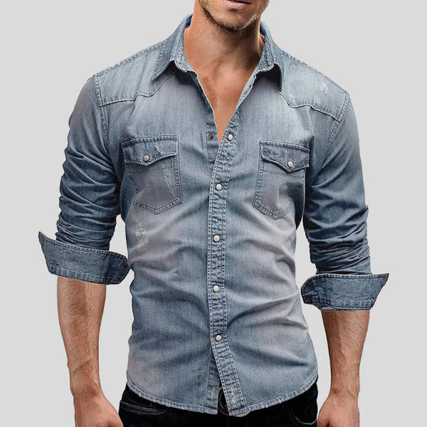 Men's slim fit denim shirt with long sleeves and button-up front, perfect for a classic casual look.