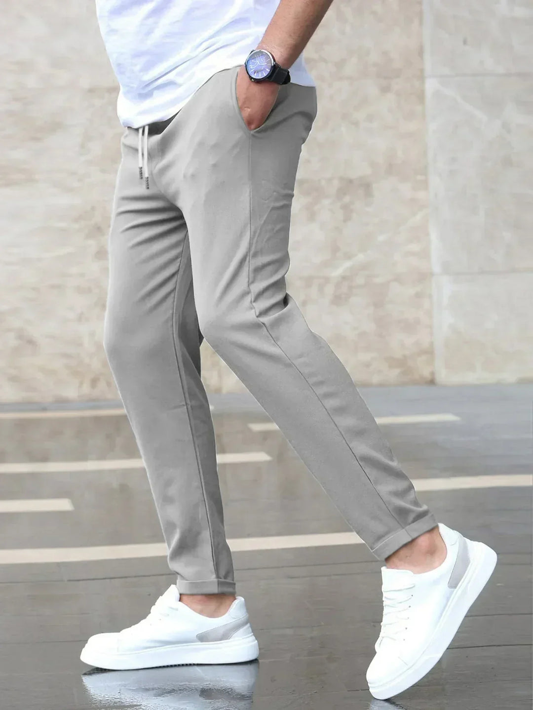 Stylish men's tapered fit trousers with drawstring, ideal for a smart casual look or relaxed comfort.