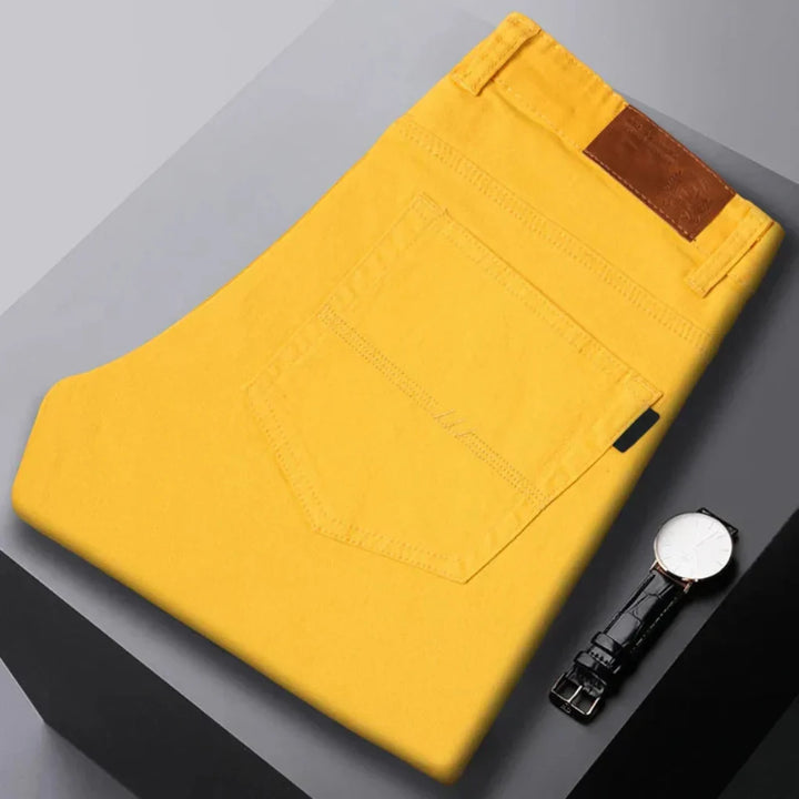 Men's slim fit everyday jeans in a dark wash, perfect for modern casual style and versatility.