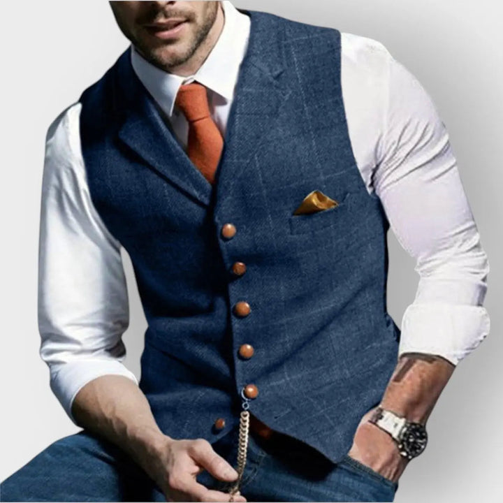 Blue men's slim fit herringbone vest, a stylish button-up waistcoat perfect for layering & formal fashion.