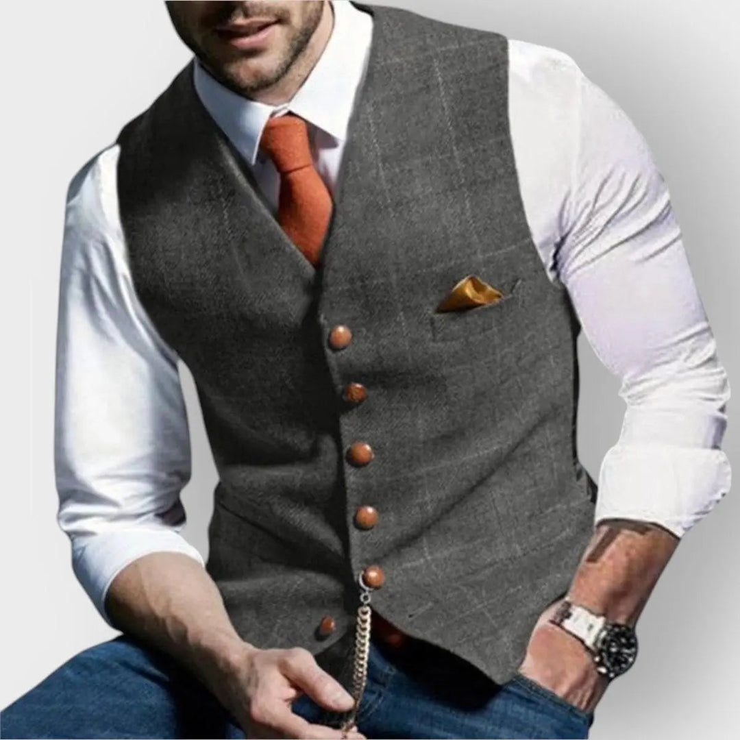 Grey slim fit men's herringbone gilet waistcoat. Versatile button-up vest for smart casual and business attire.