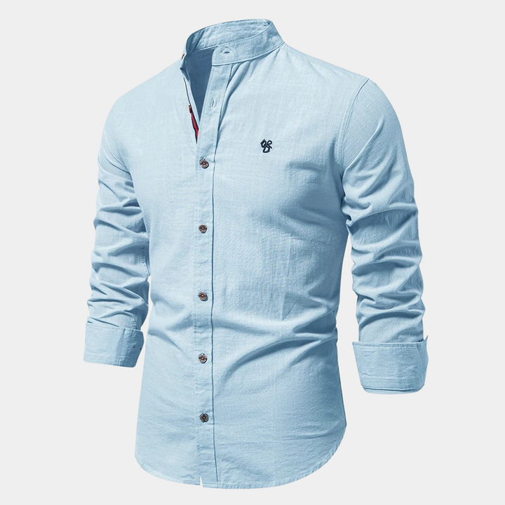 Man wearing a breathable slim fit long-sleeve summer shirt, styled casually for warm weather.