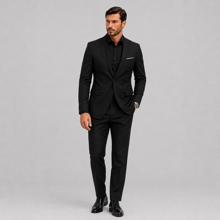 Elegant men's slim fit formal suit, ideal for weddings & special events. Modern two-piece business attire in black.