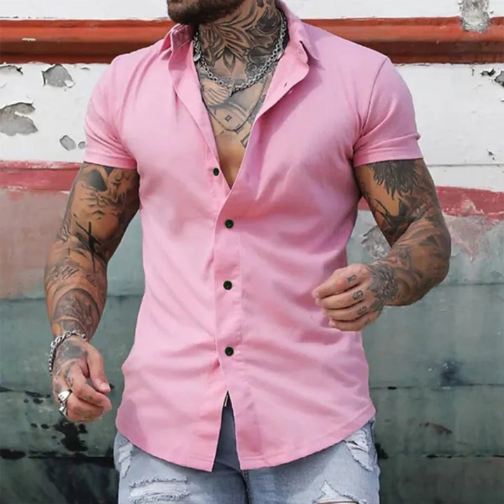 Close-up of a men's slim fit short sleeve button-up shirt. Casual yet modern for versatile summer styling.