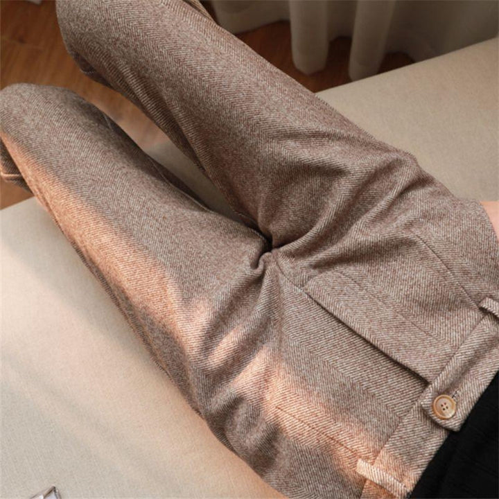 Close-up of fabric detail on men's beige slim fit tailored ankle pants, showcasing quality spring style.