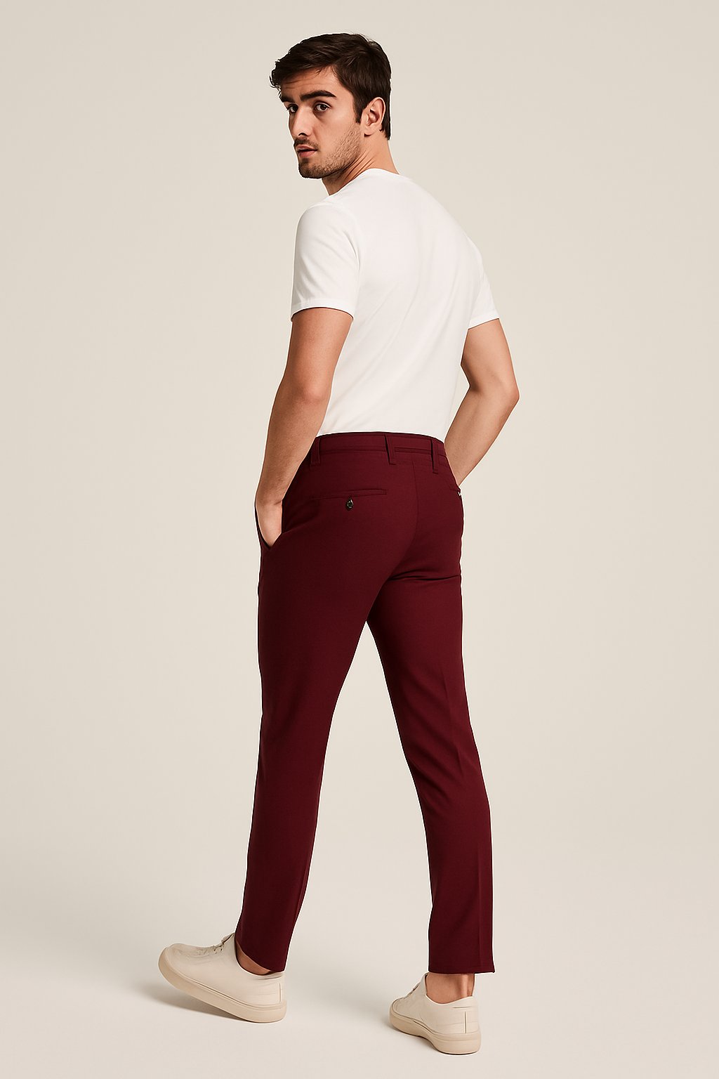 Model in smart casual men's slim-leg khaki chinos. Tailored fit perfect for work or weekend versatility.