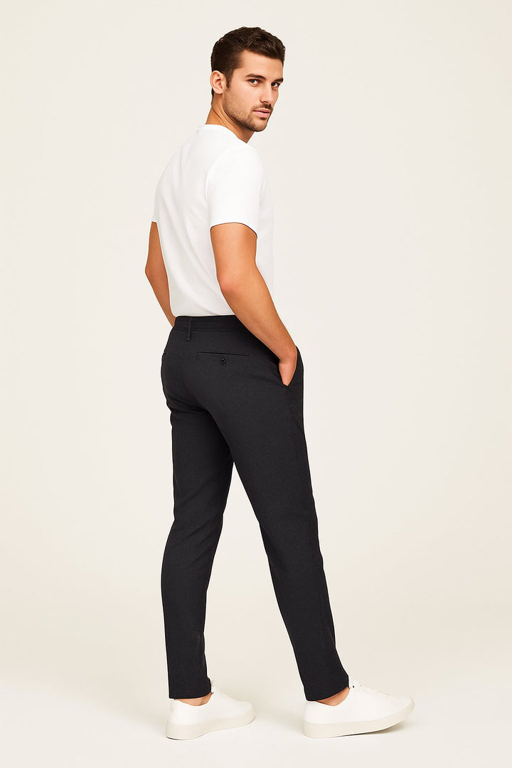 Back view of men's comfortable slim-leg chinos in beige. Tailored design, versatile for smart casual outfits.