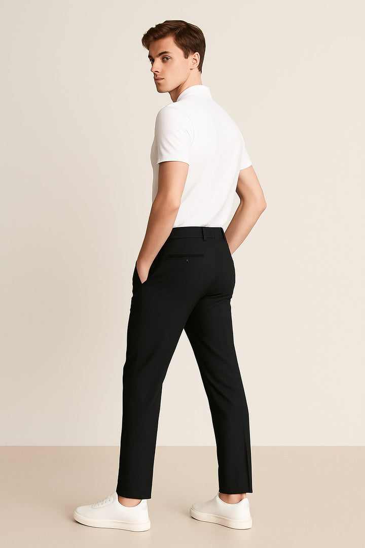 Man wearing casual men's slim-fit woven chino pants in olive. Perfect for relaxed yet stylish everyday looks.