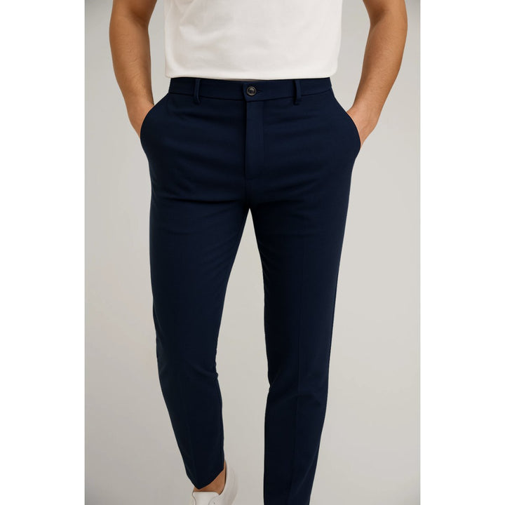 Tailored men's slim-leg chinos in classic black, styled for smart casual office or an evening event.